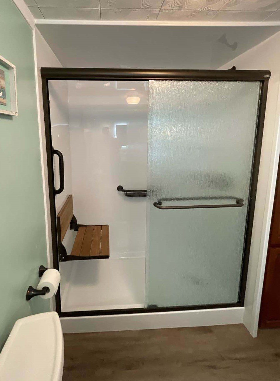 Accessible walk-in shower complete with safety accessories.