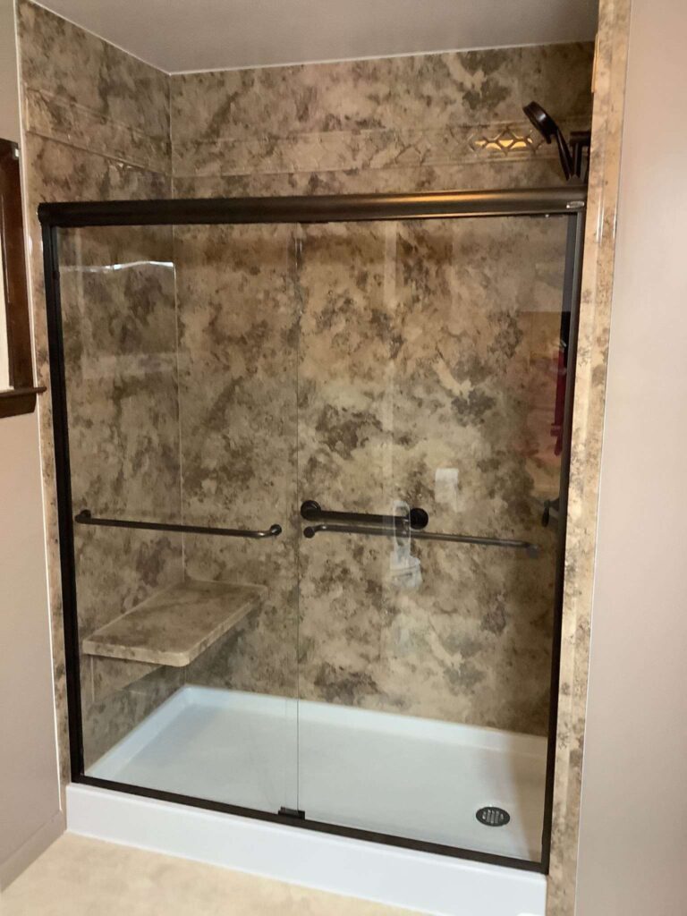 Completed shower conversion with oil rubbed bronze fixtures